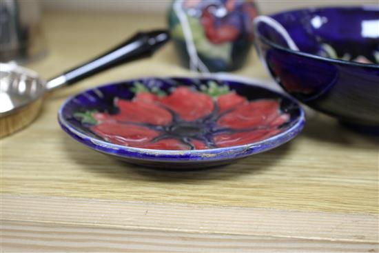 A Moorcroft Anemone small bowl, a similar pin dish, a small Hibiscus vase and a Clematis pin dish (4)